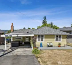 Welcome home to this lovely Des Moines rambler! Note the carport parking that leads straight into the home.