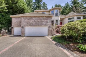 Beautiful brick and stucco home with expansive driveway and 3 car garage.