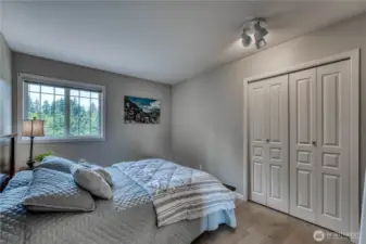 Bedroom #3 with hardwood flooring.