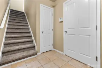 Foyer area with door to garage on the right