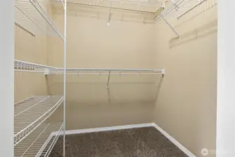 Primary bedroom walk-in closet.