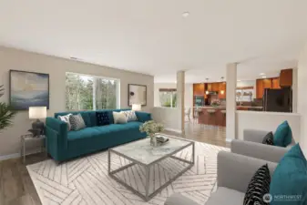 Large family room opens to kitchen and dining area *virtually staged*