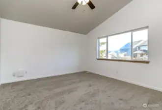 Primary bedroom looks out to backyard