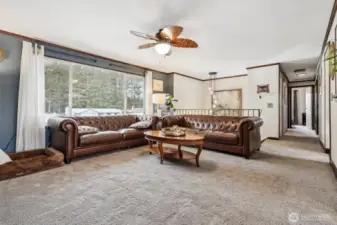 Living room with large picture window so you can enjoy the view of all the trees