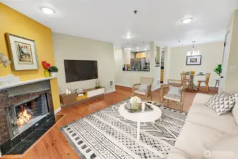 This view is from the corner near the patio door back towards the fireplace. This wood burning fireplace and room are virtually staged.