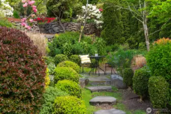 Extensive mature landscaping provides serene setting