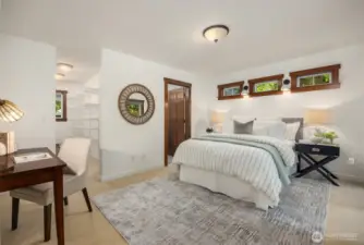 Bedroom number 2 with walk-in closet and room for a sitting area and/or desk.
