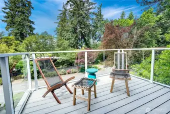 West-facing deck off the primary bedroom is the perfect spot to start the morning with coffee or meditation, and end the day with wine and sunsets. Catch peek-a-boo lake and mountain views in the Winter months.
