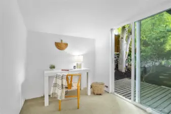 Office space off the primary bedroom with a slider to the backyard.