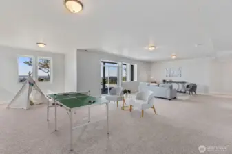 9 foot ceilings, large windows and a slider to covered patio an expansive Trex deck and VIEWS!