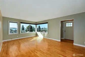 Entrance has an inset before stepping into the large bright beautiful living room!