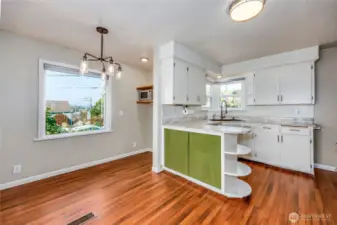 Another view of the kitchen and dining room.