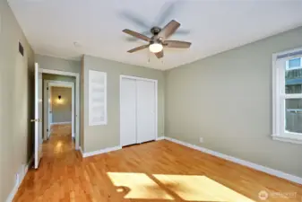 2nd bedroom has sweet built-in shelves along side the closet.