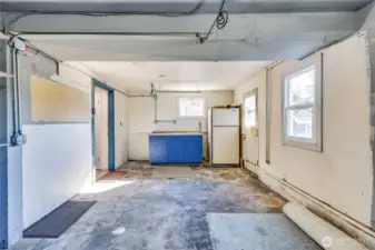 One car garage with work bench and refrigerator included.