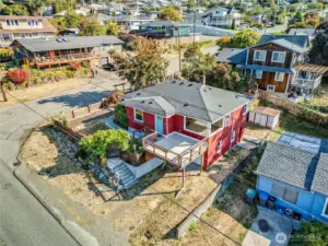Corner view lot with deck, grapevines and garden beds!