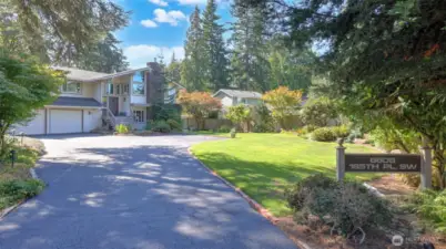 Expansive 18,371 sq ft level lot surrounds this remodeled home