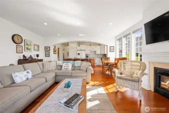 Living area to the kitchen featuring the fireplace