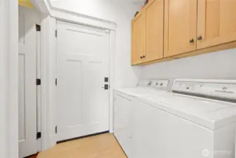 The laundry area with closet and garage entrance