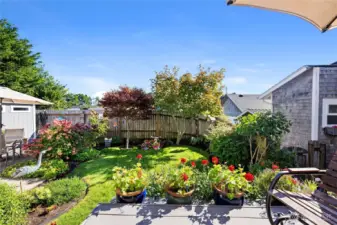 Beautiful landscaped outdoor space just of the deck. Very manageable for those who don't enjoy the yard work.