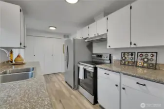 The kitchen is spotless and the laundry center is convenient with additional panty space...