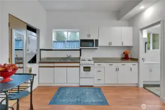 The ADU has an apartment stove and oven plus a microwave and a refrigerator, all stay!