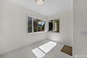 Breakfast nook area with tranquil property views...