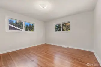 Primary bedroom... seller is having the gas seal in the left window repaired...