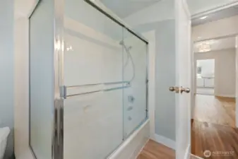 2nd view of main bathroom with nice size tub and shower