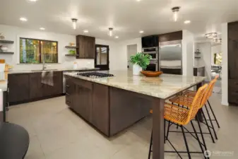 Off the kitchen is a walk-in pantry with built-in shelving for your additional storage needs.