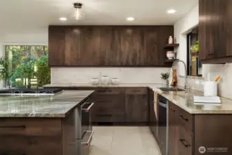 New stainless appliances and a gas cooktop on the island add to the appeal of this kitchen.