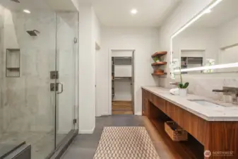 Another view of the primary bath with a walk-in closet.