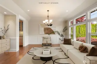 Formal front room by entry virtually staged.