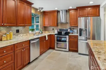 Another photo of the stunning kitchen with stainless appliance package.