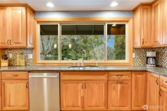 View the magical backyard and decks from your kitchen sink.