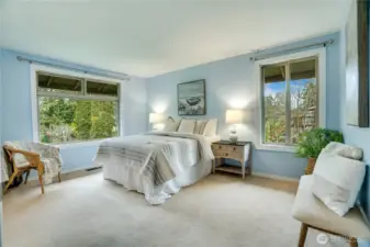 Large primary suite is soothing and large enough for your king-sized bed and furnishings!  Private upgraded bathroom features heated tile floors.