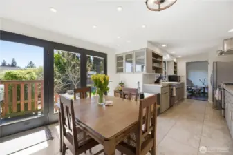Dining room with sliding doors to deck and yard