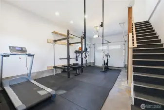This is the garage which is being used as a gym - upstairs is a HUGE, finished loft are perfect for office, guest room, music room