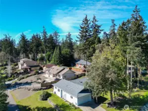 Settle into relaxed single-story living in this cheerful North Beach home, perfectly placed near parks, trails, and shoreline  adventures. Thoughtful updates run throughout the 3-bedroom, 2-bath floor plan, including a new 2025 roof, newer  appliances, and vinyl plank flooring that stands up beautifully to everyday life. Energy-conscious ductless mini-splits  provide efficient heating and cooling, while a freestanding wood stove in the living room adds warmth and character on  cooler days. Wide glass doors draw you out to the sunny, south-facing back deck—a natural extension of the living space for  outdoor dining, container gardening, or simply kicking back in the quiet. The private primary suite opens directly to this  deck as well, making it easy to step outside with your morning coffee or unwind under the stars. An attached two-car  garage, level corner lot with garden space, and available high-speed internet round out a home that is ready for both easy  living and remote work in P