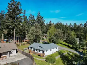 Settle into relaxed single-story living in this cheerful North Beach home, perfectly placed near parks, trails, and shoreline  adventures. Thoughtful updates run throughout the 3-bedroom, 2-bath floor plan, including a new 2025 roof, newer  appliances, and vinyl plank flooring that stands up beautifully to everyday life. Energy-conscious ductless mini-splits  provide efficient heating and cooling, while a freestanding wood stove in the living room adds warmth and character on  cooler days. Wide glass doors draw you out to the sunny, south-facing back deck—a natural extension of the living space for  outdoor dining, container gardening, or simply kicking back in the quiet. The private primary suite opens directly to this  deck as well, making it easy to step outside with your morning coffee or unwind under the stars. An attached two-car  garage, level corner lot with garden space, and available high-speed internet round out a home that is ready for both easy  living and remote work in P