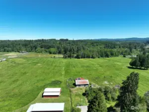 26 acres of prime pastureland includes 2 barns, 2 lots, and a well.