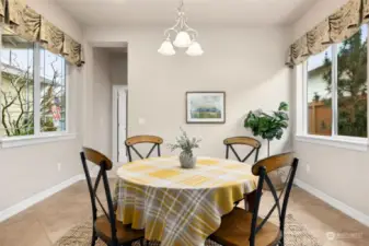 Kitchen nook view with lots of light from windows on both sides.