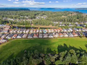 This view is showing a North exposure with a picture of the Puget Sound in the back drop. Jubilee has a three mile paved bicycle/walking trail to one mile of beach front.