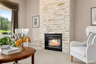 Gorgeous floor to ceiling custom stone surround gas fireplace makes for a wonderful warm focus.