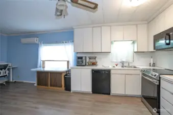 Another angle of the kitchen, showcasing its spacious and open layout.