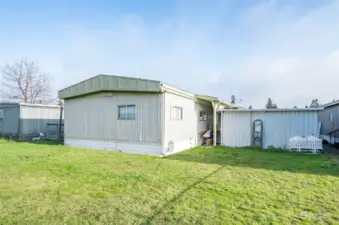 The back exterior of the home offers a glimpse of its outdoor design.