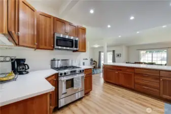 Stainless steel appliances include a gas stove/range.