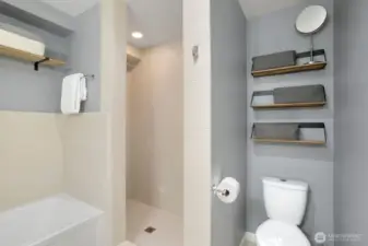 Primary bathroom has both a tub and shower.