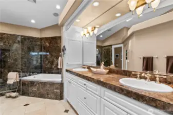 Primary ensuite bath with separate jetted tub & shower, & marble tiling