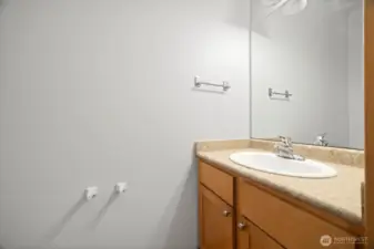 This half bath is on the main floor and adjacent to the garage.