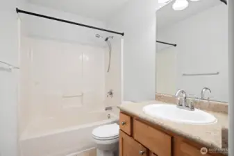 The other full bath is between bedrooms upstairs.